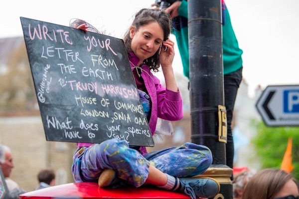 Photo of a woman with a placard