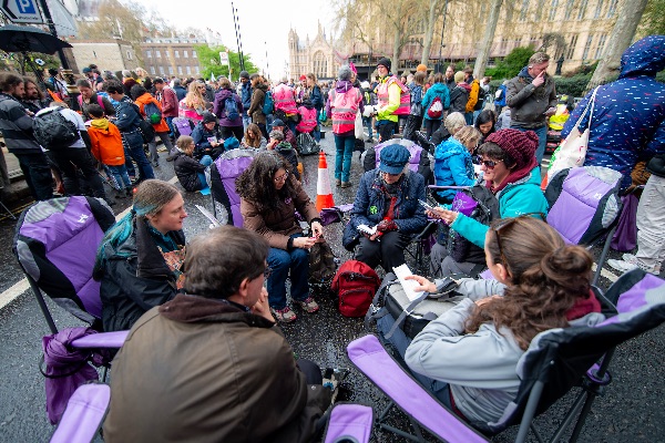 Photo showing a group of people talking together