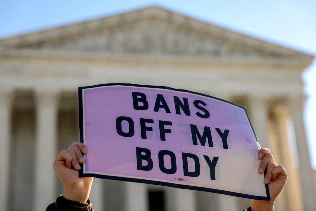 Bans Off My Body sign held up at the Supreme Court during a rally for reproductive rights