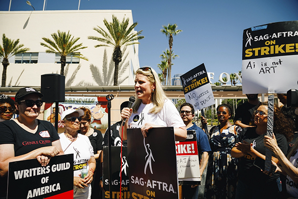 AFL-CIO President Liz Shuler speaks during a SAG-AFTRA and Writers Guild of America West (WGAW) picket in Los Angeles at the Fox Studio Lot. | Brittany Woodside/AFL-CIO
