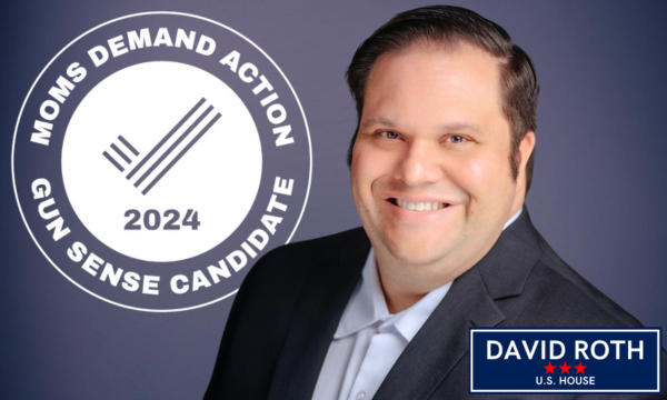 A graphic featuring a photo of a smiling David in front of a blue background and the 2024 seal for Moms Demand Action Gun Sense Candidates.