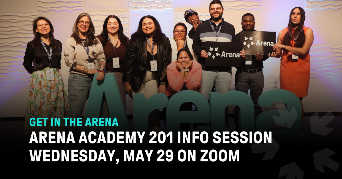 A group of smiling people in front of large cut out letters that say Arena. 