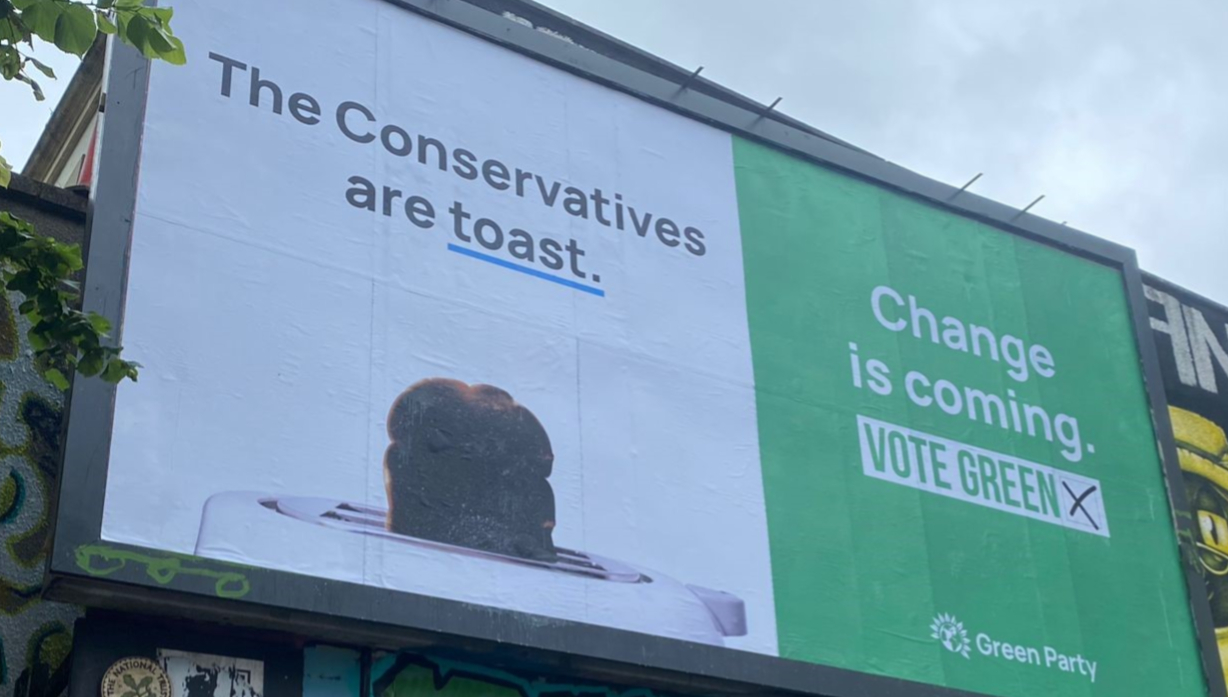 The Conservatives are toast, change is coming - Vote Green. Green Party campaign billboard in a target constituency.