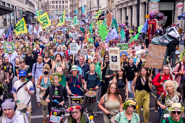 A photo showing many people marching along the route