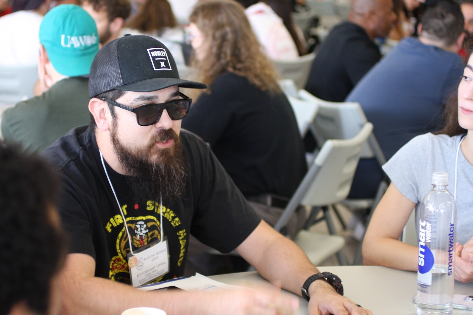 Close-up of one UAW member speaking to others at a table