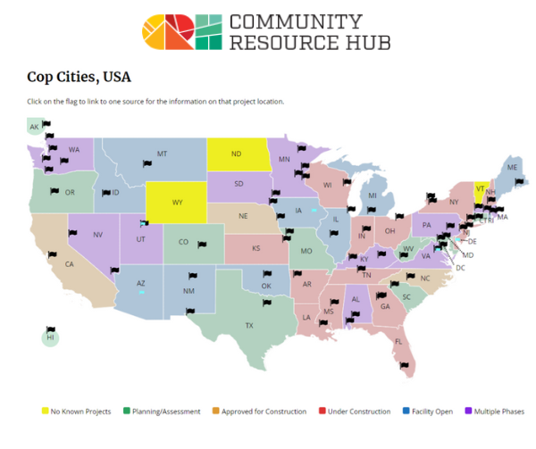 A graphic from Community Resource Hub featuring a map of the USA and pins indicating cop cities planned, under construction, or in operation.