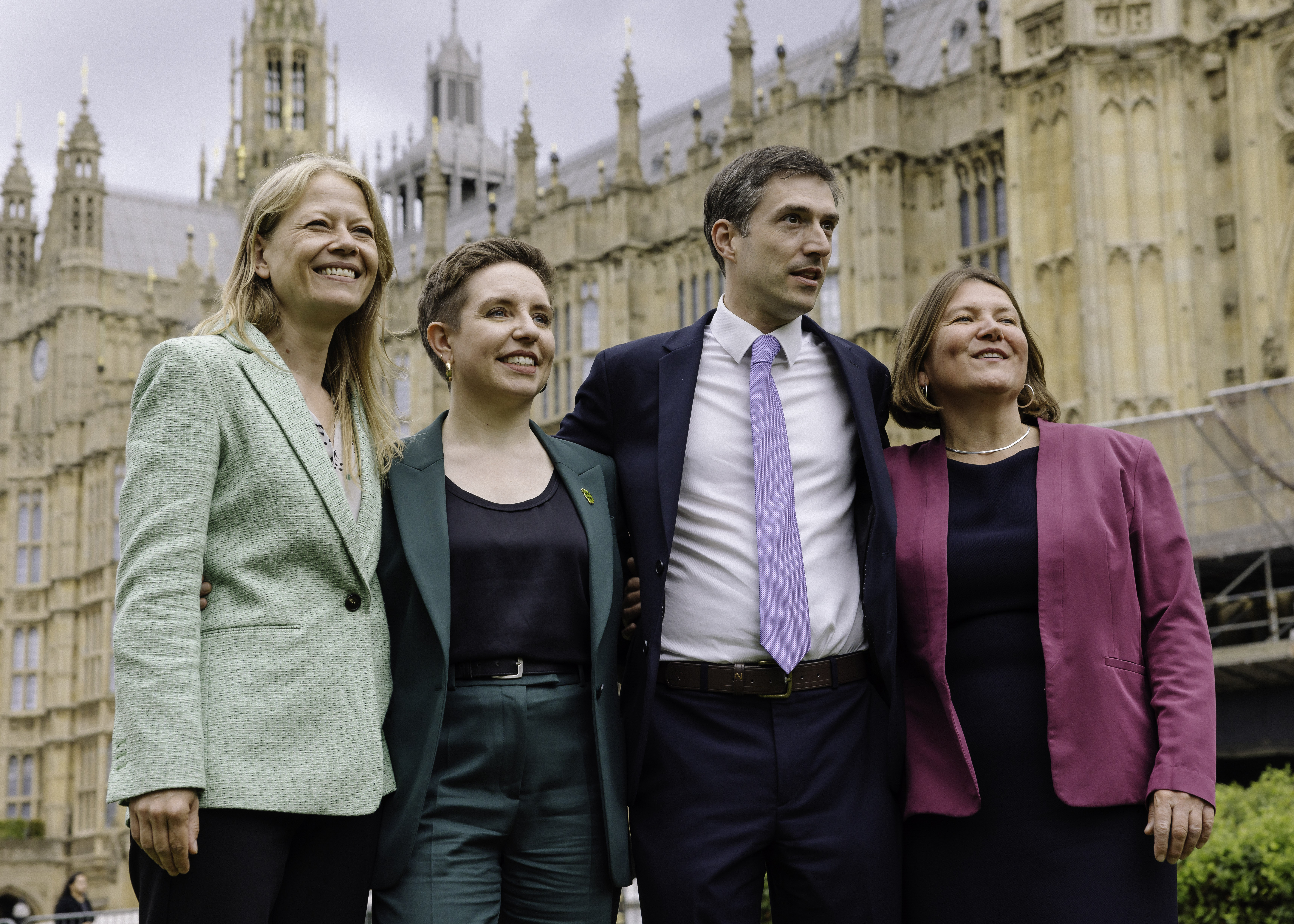 Sian, Carla, Adrian and Ellie standing together outside parliament. 