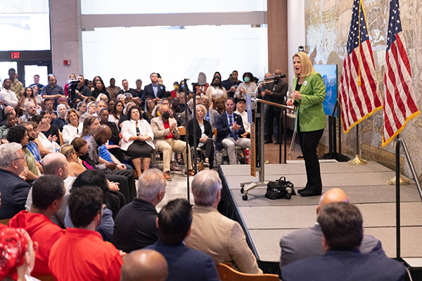 AFL-CIO President Liz Shuler speaking to a crowd inside the AFL-CIO headquarters.