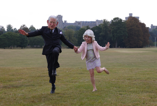 Fancy dress Charles and Camila - skipping across the campsite.