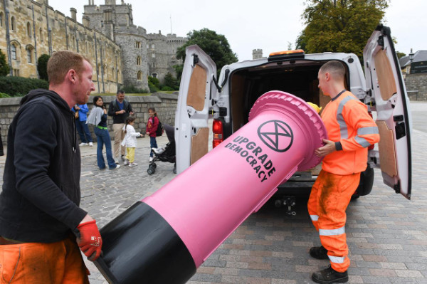 Postbox being carried in to a council van and taken away