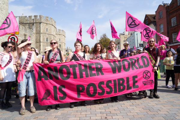 Young activists holder the Another World is Possible banner