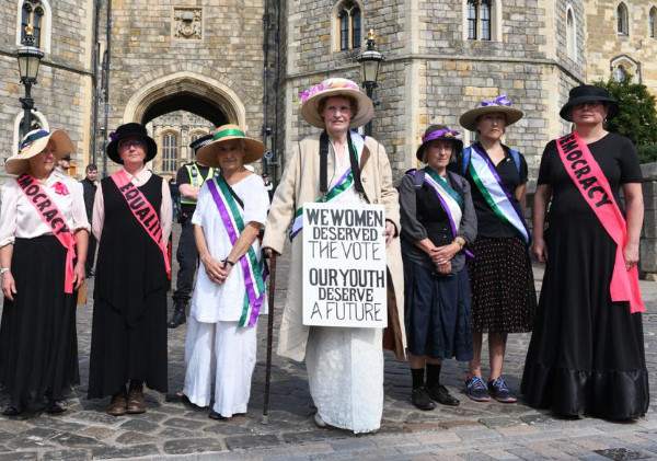 Women dressed as suffragettes