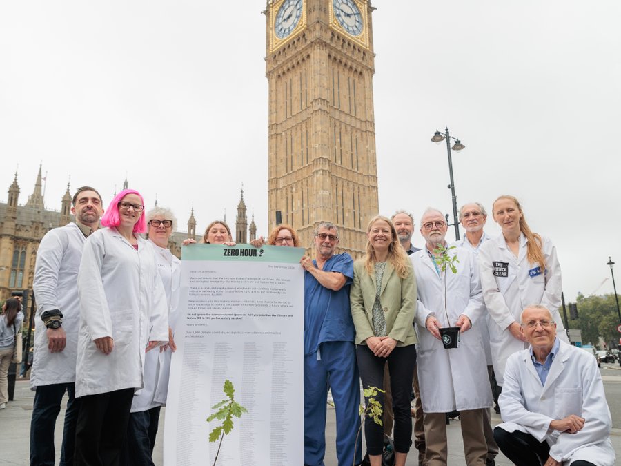 Sian Berry outside parliament with climate scientists and experts.