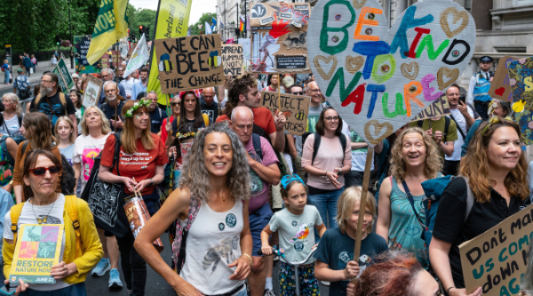 Smiling people on the Restore Nature Now march