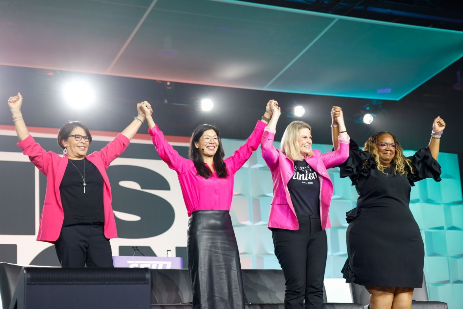 A photo of, from left, Rocio Sáenz, Ai-jen Poo, Liz Shuler and April Verrett at the SEIU Convention in May 2024.