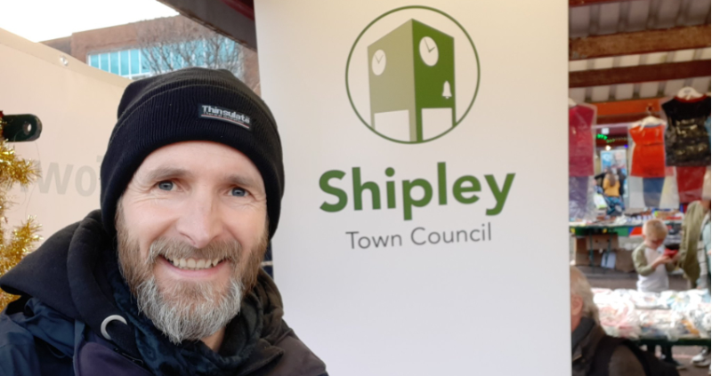 Just resigned Green councillor Darren Parkinson, standing in front of Shipley Town Council sign.