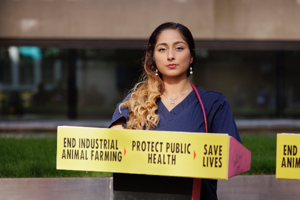 XR Health protestor holds up sign outside DEFRA