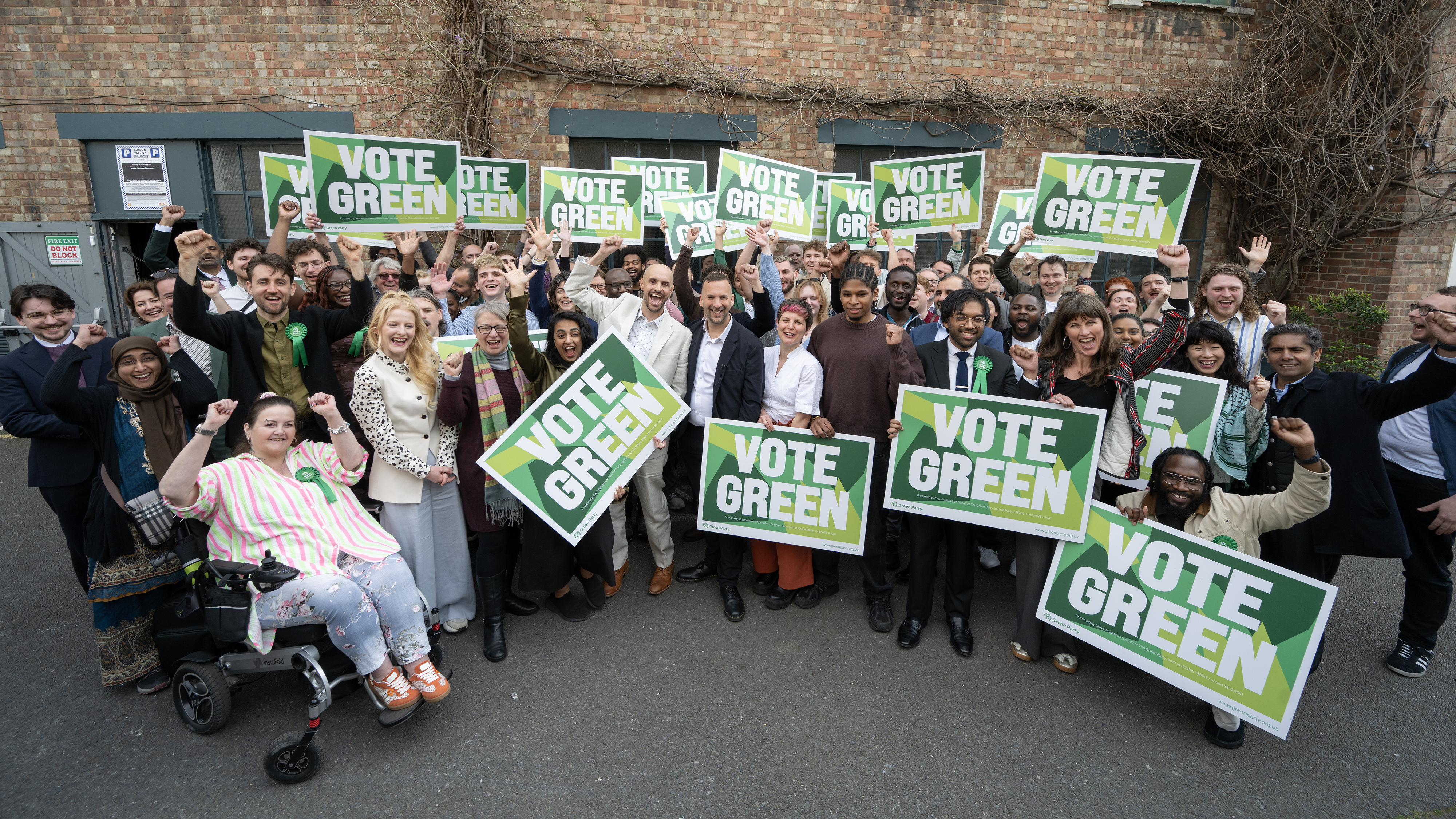 Pictured: Greens cheering holding Vote Green signs at our local elections launch.