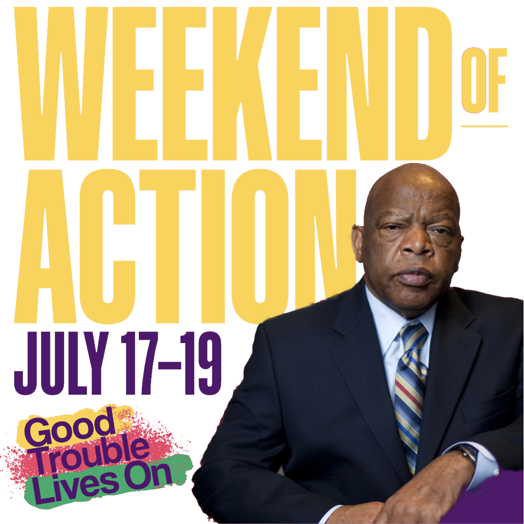 John Lewis sits in front of the words 