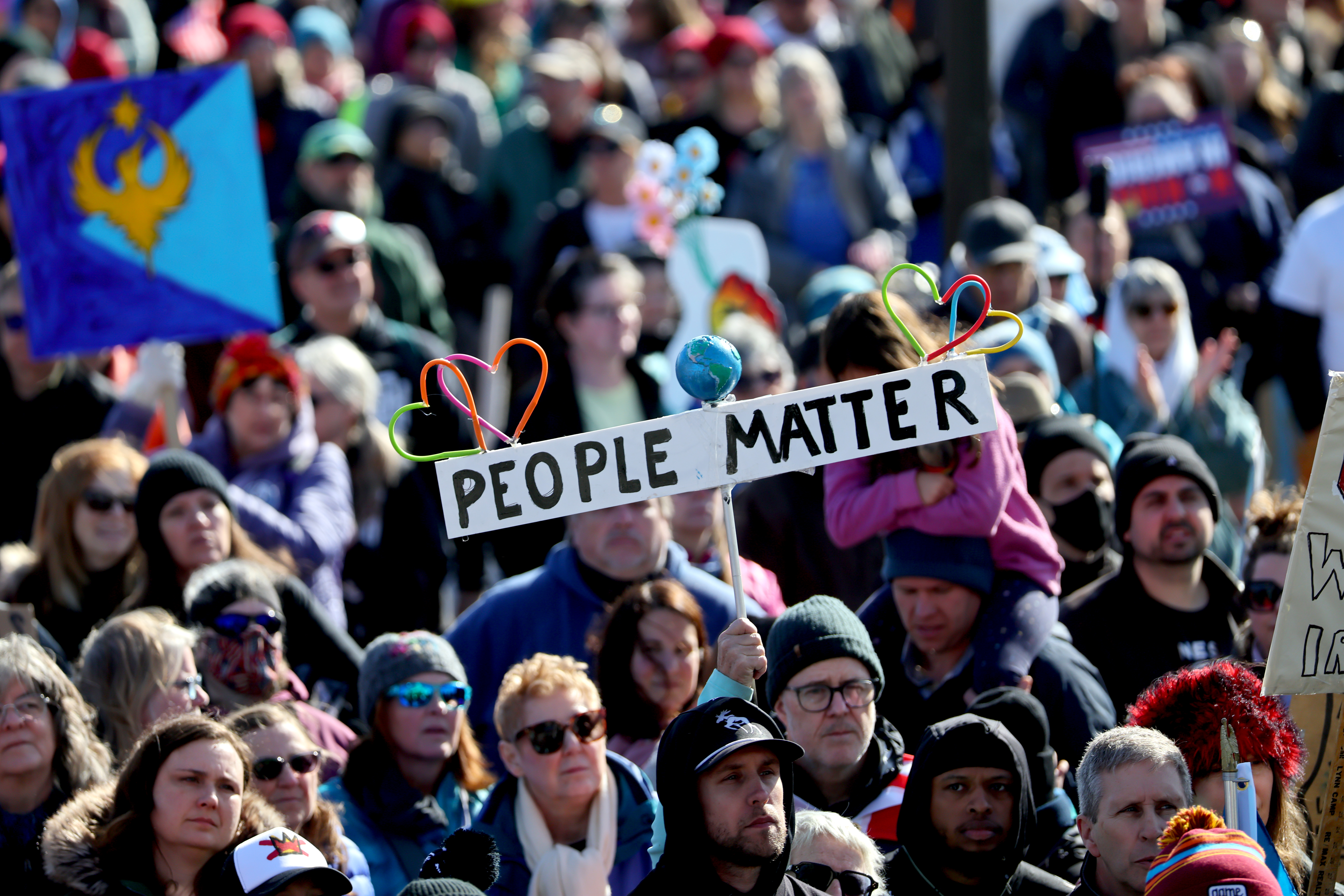 A 'People Matter' protest sign is visible in the crowd at the No Kings 3 protest. Click on the image to go to the YouTube video of the No Kings rally at the Minnesota State Capitol, featuring Bruce Springsteen alongside national and local activists and leaders. 